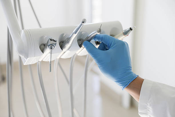 Professional Tooth Extraction technician working in Sand Lake, MI